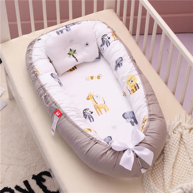Nid bébé douillet avec oreiller – Berceau portable et sécurisant